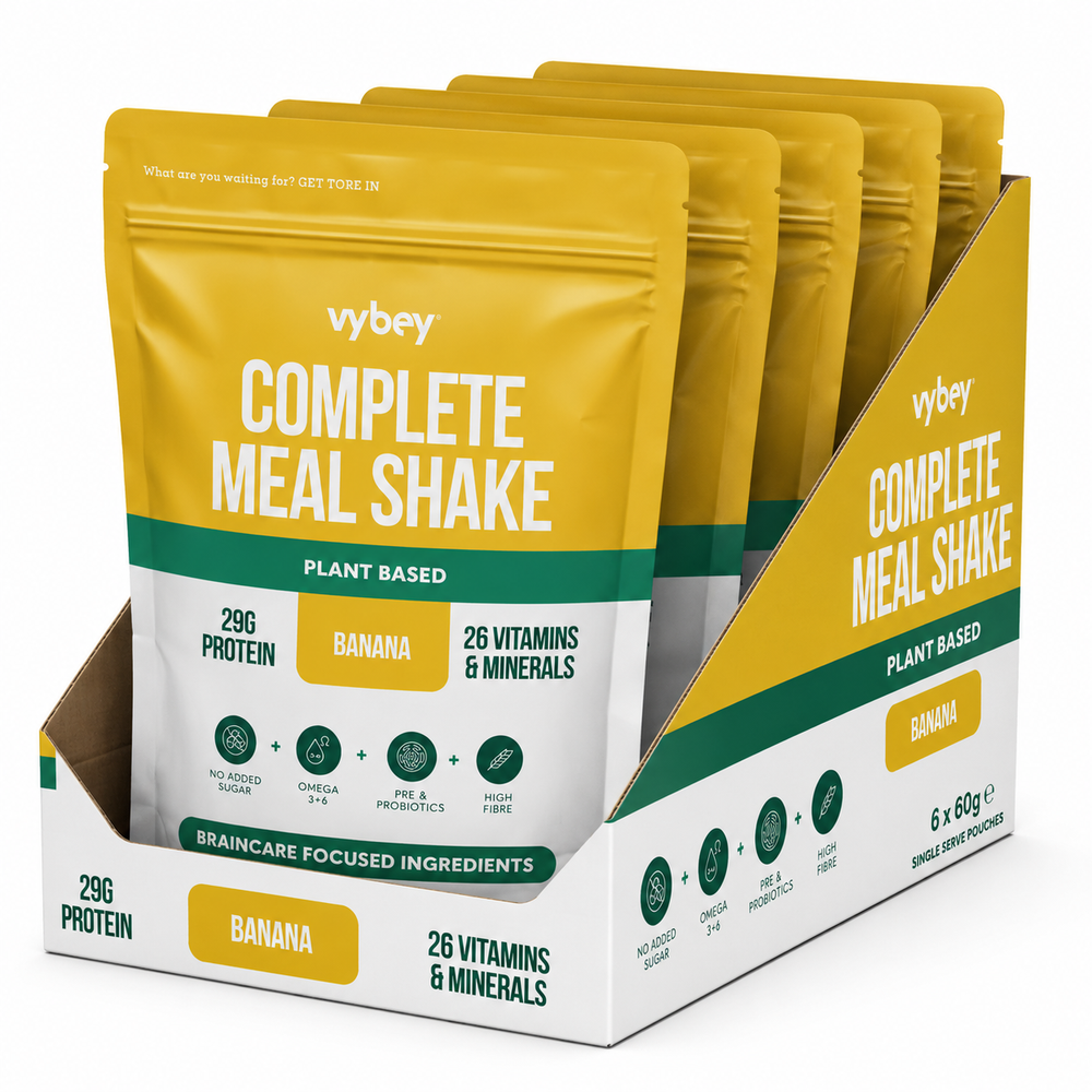 VYBEY Complete Meal Shake Banana plant-based single-serve pouches in a retail display box, featuring 29g protein and 26 vitamins and minerals.